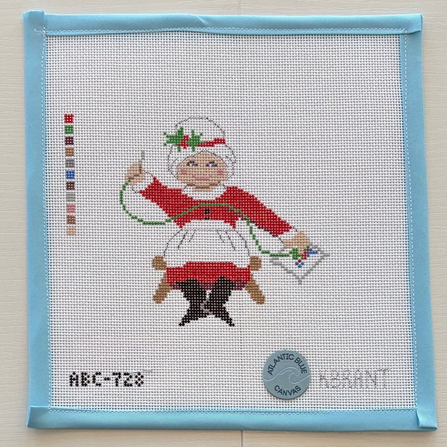 Needlepointing Mrs. Claus